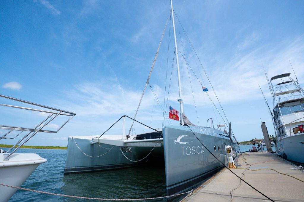 Moxie 61 Tosca cockpit with teak sole and enclosed dining area
