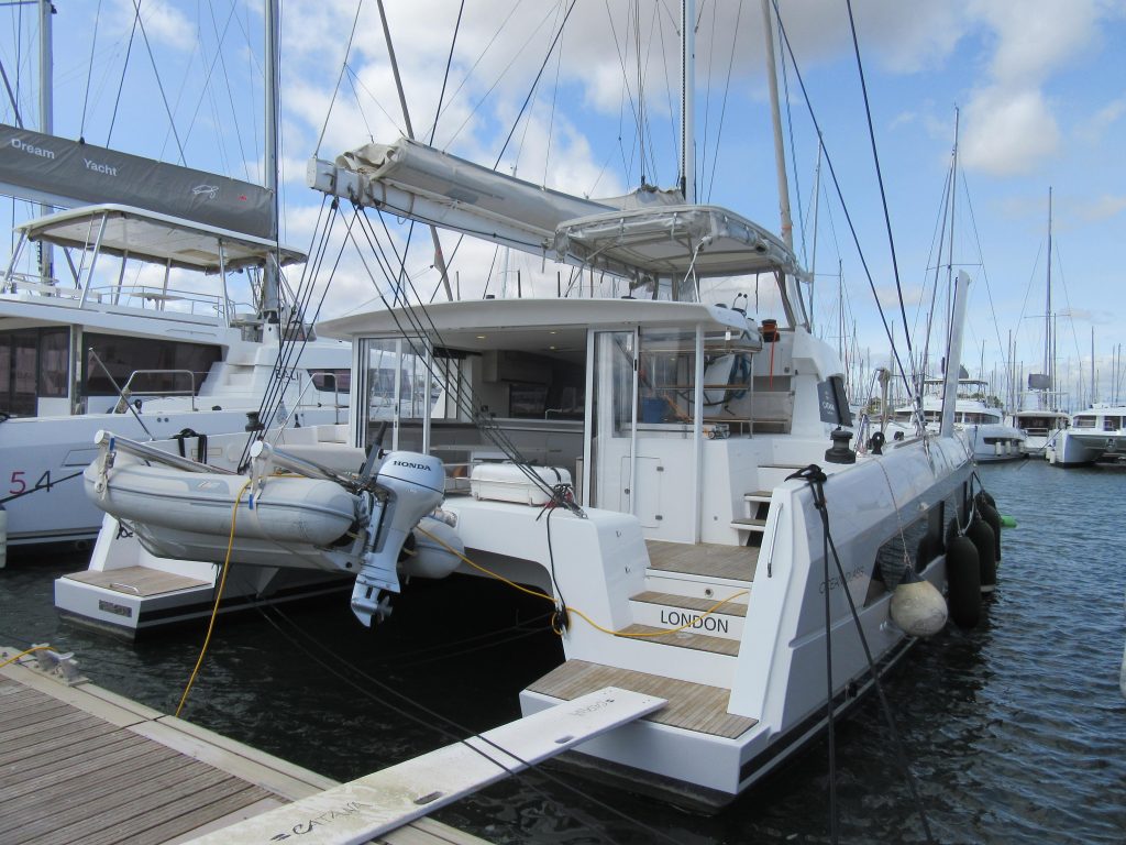 Interior of the Catana 50 Ocean Class saloon with panoramic forward windows and L-shaped seating