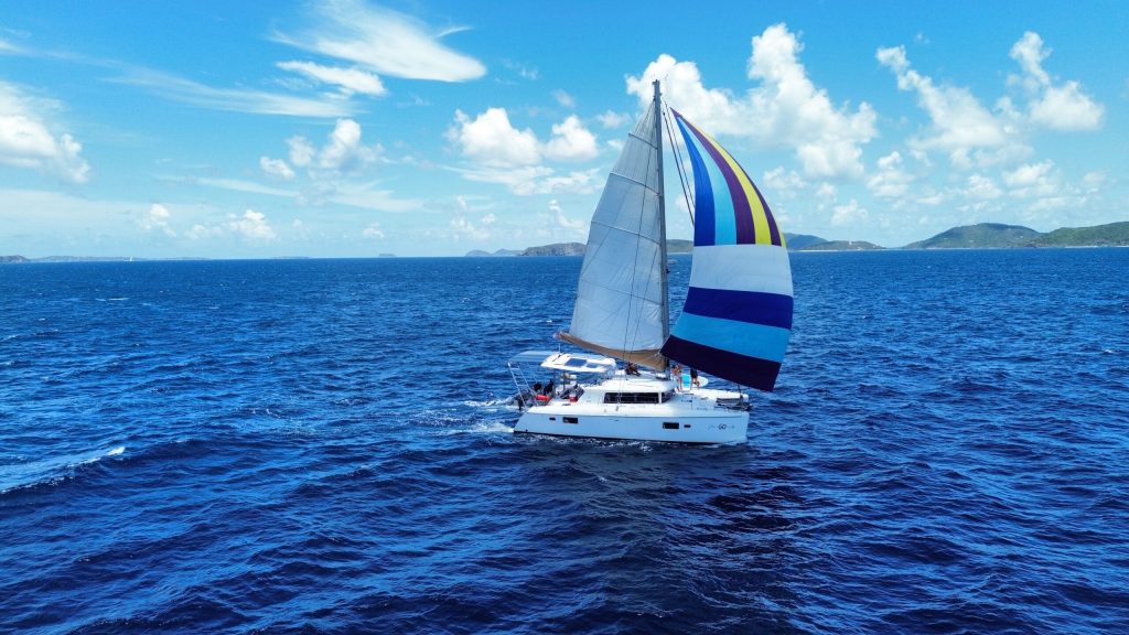 Lagoon 420 catamaran S/V GO under way with solar array on the cockpit roof