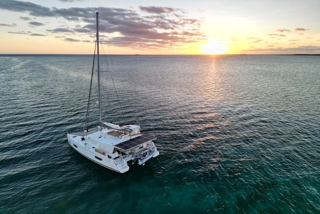 Overhead drone photograph of the Leopard 48 catamaran S/V Aloha at anchor