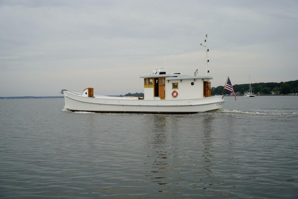 The 1938 Chesapeake Bay buyboat M/Y Choptank afloat, showing her long open foredeck and aft pilothouse