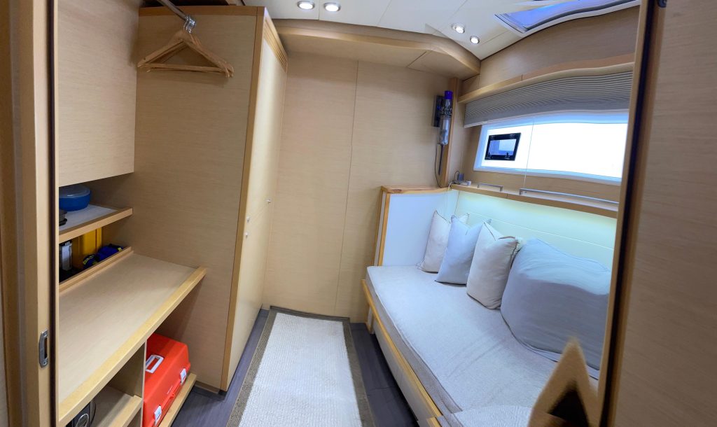 Lagoon 620 S/V Phoenicia under way with hardtop bimini and twin helms