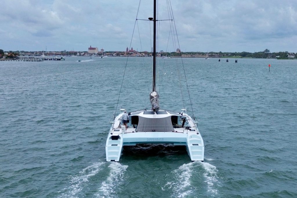 Interior saloon and galley of the Alibi 54 with nav station and stainless steel counters