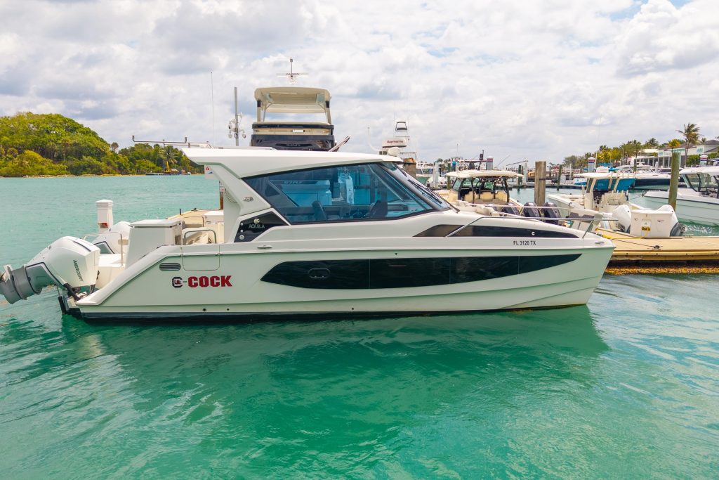 Aquila 36 Sport Cruiser Edition underway with twin Mercury Verado outboards