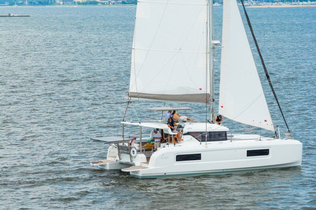 2026 Lagoon 38 catamaran under sail with square-top mainsail and self-tacking jib