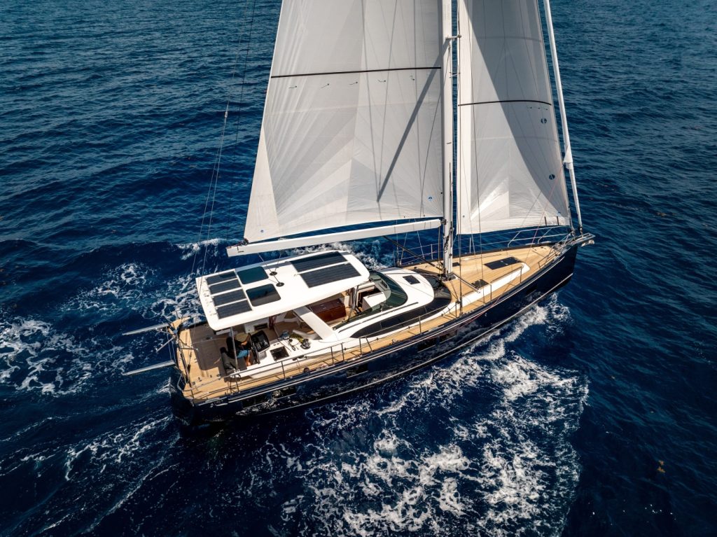 The Hylas H57 sailing with her flag blue hull and white sails set